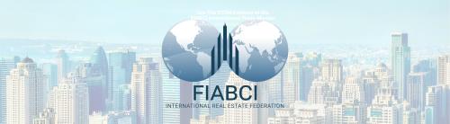 FIABCI logo with blue globe over a city skyline background.